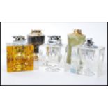 A group of vintage retro 20th century lighters to include acrylic block lighters, onyx lighter,