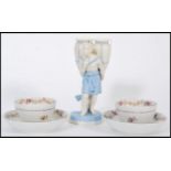 Royal Worcester - A Royal Worcester 19th Century Bisque figurine of a water carrier in blue and