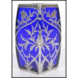 A 19th century blue glass vase of square form having silver overlay decoration depicting flowers and