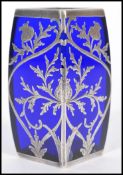 A 19th century blue glass vase of square form having silver overlay decoration depicting flowers and