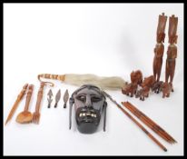 A collection of vintage 20th Century African tribal items to include a hard wood wall hanging face