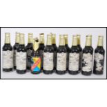 A group of 14 bottles of vintage Samuel Smith's Imperial Stout with paper labels and one bottle of