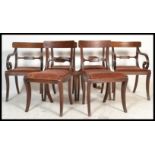 A set of 6 19th century Regency mahogany bar back dining chairs being raised on sabre reeded