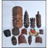 A collection of vintage wooden African tribal masks - wall hanging. To include hardwood and ebony