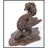 A 20th Century carved wood wall mount in the form of a mythical creature, dragon / griffin.