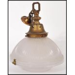 A mid 20th century vintage retro fluted glass ceiling pendant light shade, with brass fittings