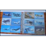 A collection of 200 plus aviation related postcards held within an album. Album 35cm-high 36cm-wide.