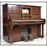 An early 20th century mahogany upright Steck Pianola ' Duo-Art ' being retailed by Duck, Son &
