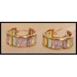A pair of hallmarked 9ct gold hoop earrings set with pastel coloured stones. Hallmarked Sheffield.