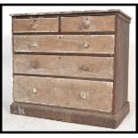 A 19th century Victorian distressed pine 2 over 3 chest of drawers having a sanded finish and the