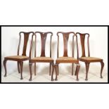 A set of 4 Edwardian mahogany Queen Anne high back dining chairs being raised on cabriole legs