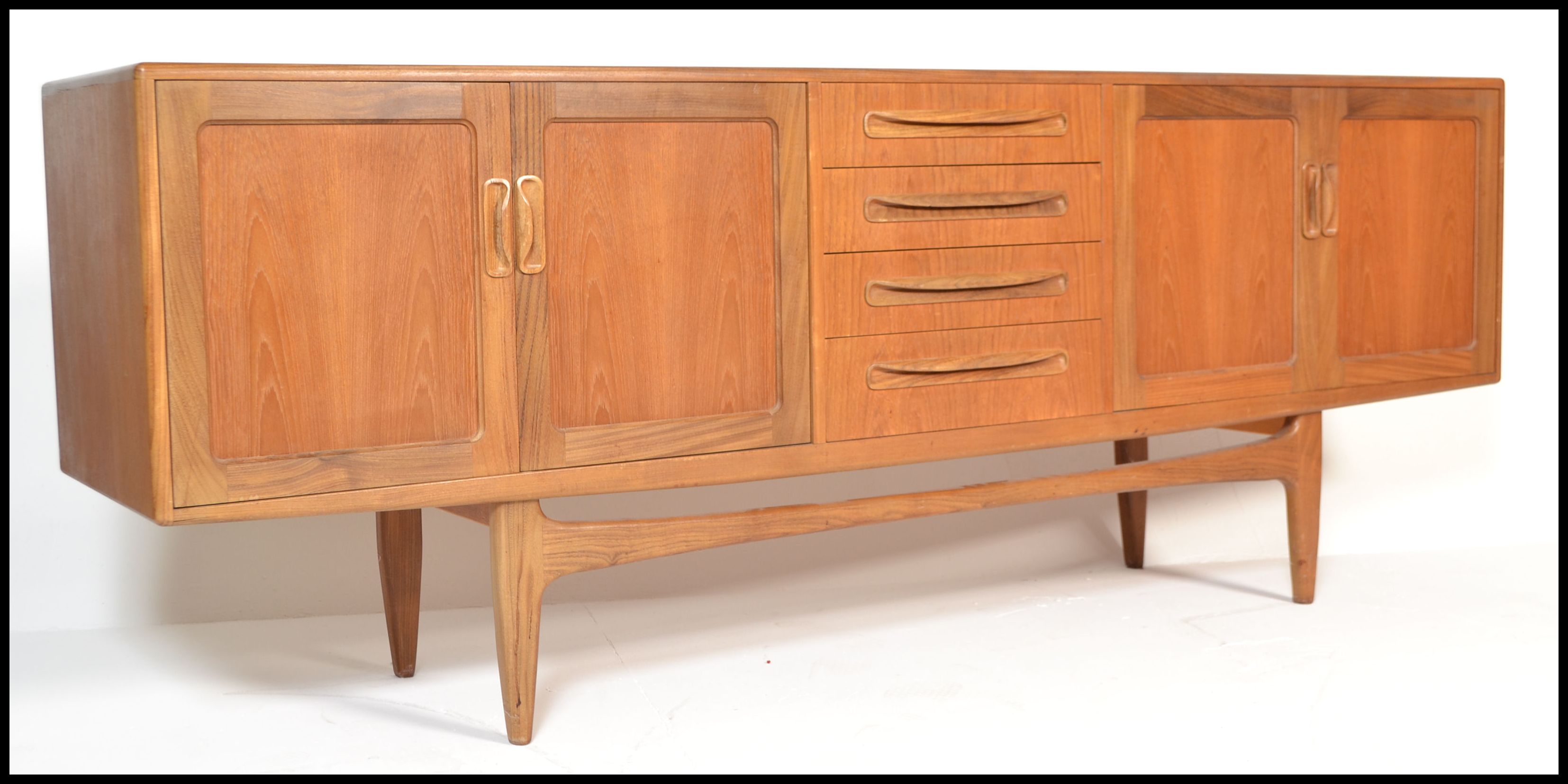 A retro G-Plan teak wood long and low sideboard from the Fresco range, with four central drawers,