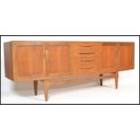 A retro G-Plan teak wood long and low sideboard from the Fresco range, with four central drawers,