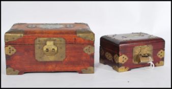 Two vintage 20th century Chinese boxes having carved jade panels to lids.  Both with brass locks and