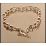 A bike chain bracelet stamped 925 indicating silver. Weight 83.3g