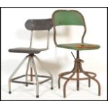 Two vintage mid 20th Century industrial machine st swivel chairs, the chairs raised on tubular