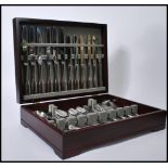 A vintage retro 20th century canteen of cutlery by Robert Welch held within a teak case. 10cm-high