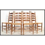 A set of 4 American style oak rattan weave ladderback dining chairs. Raised on turned legs with