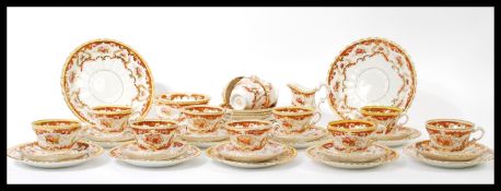 A late 19th century Royal Albert porcelain tea service comprising cups, saucers, plates, sugar