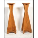 A pair of vintage 20th Century oak Art Deco style plant stands / torchere, the body made with