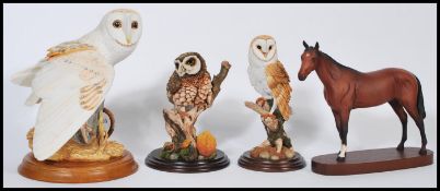 A group of ceramic and resin animals to include a Royal Doulton ceramic horse on wooden base, a