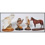 A group of ceramic and resin animals to include a Royal Doulton ceramic horse on wooden base, a