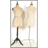 Two vintage early 20th century shop display haberdashery dress makers mannequins raised on wooden