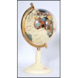 A vintage retro 20th century lapis lazuli type semi precious stone inlay desk top globe raised on