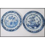 Two 18th century Chinese blue and white plates one having hand painted floral borders with central