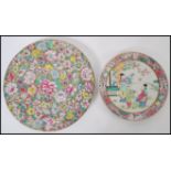 An early 20th century Chinese canton enamel plate having pink floral borders and central white