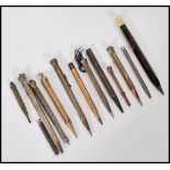 A good collection of propelling pencils dating from the 19th Century to include both gold metal