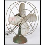 A vintage 20th century retro industrial desk ERCO fun, in green colour with 4 blades aluminium fan