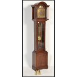 A contemporary antique style mahogany longcase clock with silvered dial being marked Tempus Fugit.