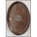 An early 20th century Hugh Wallis arts and crafts hammered copper and silver white metal tray, of