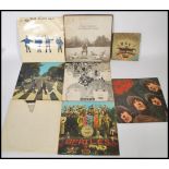 Vinyl Records - The Beatles, a collection of vinyl long play LP records pertaining to the Beatles to