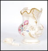 An early 19th century hand painted Staffordshire jug hand painted with floral sprays. Gilt