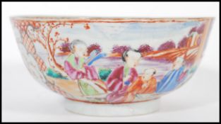 An 18th Chinese ceramic bowl having hand painting white cartouche panels depicting birds and trees
