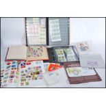 A collection of stamps to include album of unused modern stamps, first day covers, loose kiloware,