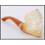 An early 20th century meerschaum smoking pipe in the form of a man wearing a turban. Measures