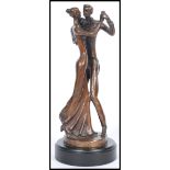 Bernard Kim (b.1942) A bronze statue figurine featuring a dancing couple raised on pedestal base.