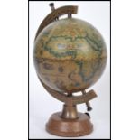 A vintage antique style drinks decanter globe featuring a classical map globe with hidden musical