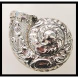 A silver plated vesta case in the form of a snail with embossed foliate detailing. Weight 16.4g.