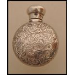 A 19th century Victorian hallmarked silver pocket perfume bottle by G Watts having scrolled