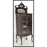 A Victorian mahogany pedestal pier display cabinet. The glass door housing enclosed shelves.