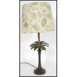 A 20th century bronze table lamp in the form of a