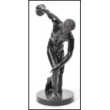 A 20th century bronze / bronzed figure after the antique The Discobolus of Myron raised on