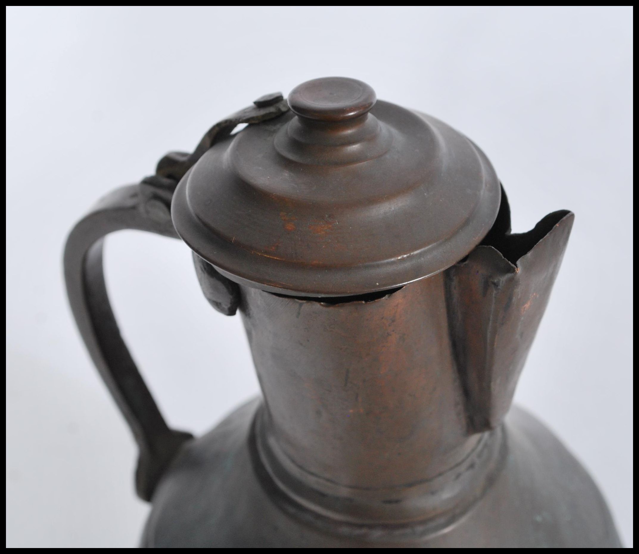 An 19th century middle eastern Persian Islamic brass and copper coffee pot Dallah, probably Turkish. - Image 3 of 4