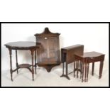 A collection of furniture to include an Ercol hanging corner cabinet, Sutherland table, nest of