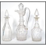 An early 19th Century English heavy cut glass Claret Jug / decanter with fitted stopper, riveted
