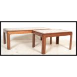 A mid century teak wood and tile top coffee table of rectangular form together with a smaller teak